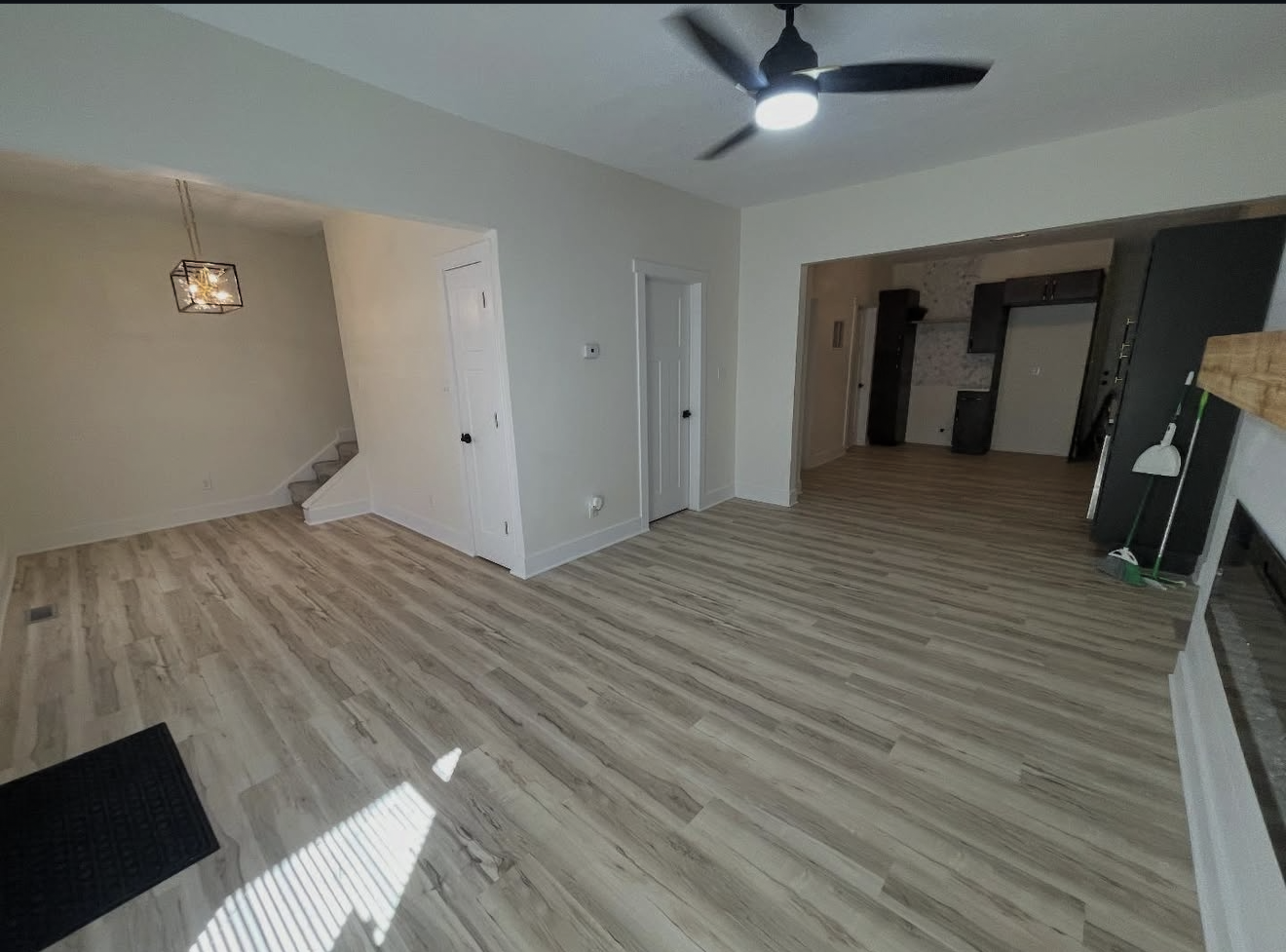 Bright open living room with new flooring, ready for a new owner